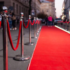 Red Event Carpet, Stair and Gold Rope Barrier Concept of Success and Triumph